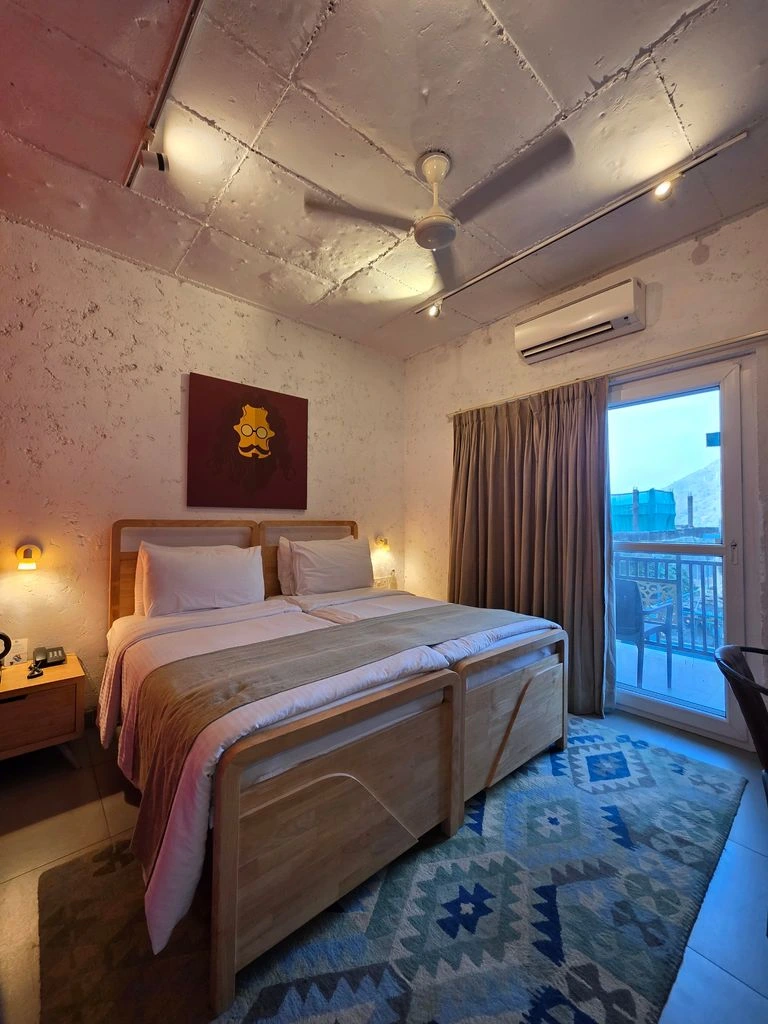 Signature room with partial Eiffel view from a small balcony